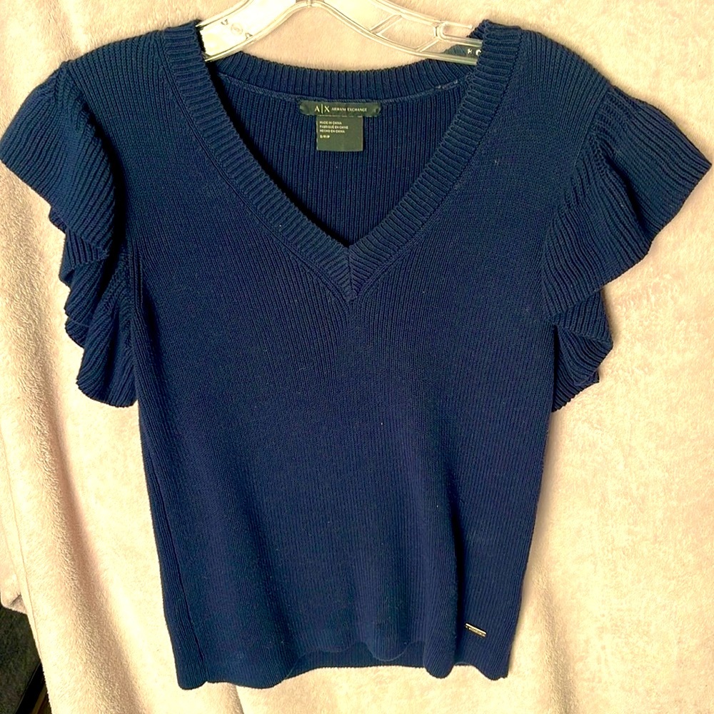 Used one time, short sleeves, navy blue, V-cut.